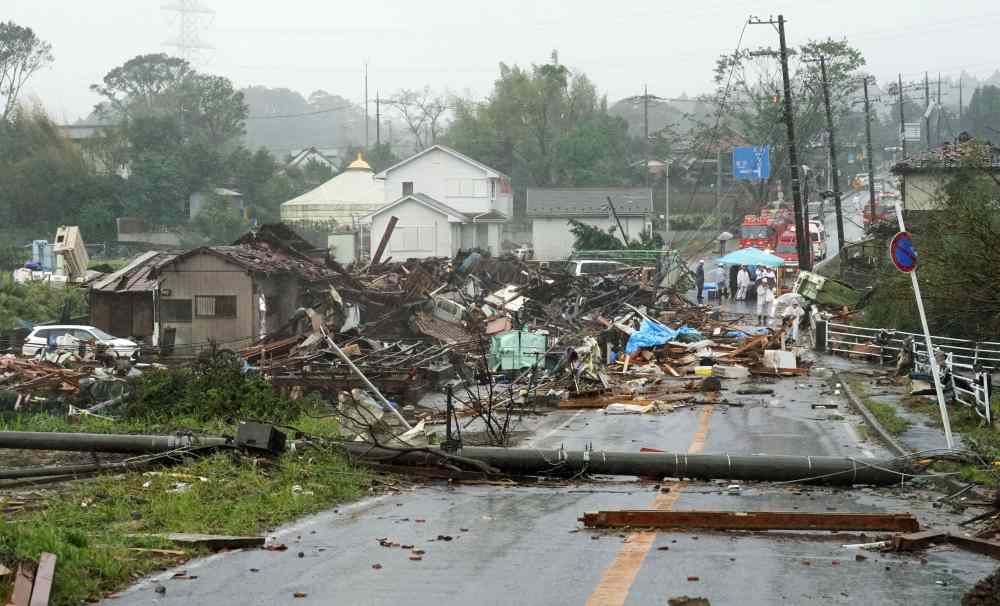 Destroyed houses, cars and power poles, which were believed to be caused by a tornado, are seen as Typhoon Hagibis approaches the Tokyo area in Ichihara, east of Tokyo, in this photo taken by Kyodo October 12, 2019. u00e2u20acu2022 Reuters pic