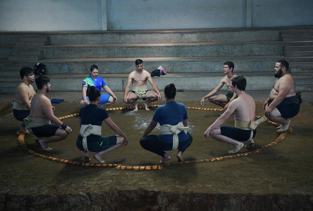 Brazil sumo wrestler Rui Junior (right) conducts a practice session with his students in Sao Paulo September 14, 2019. — AFP pic