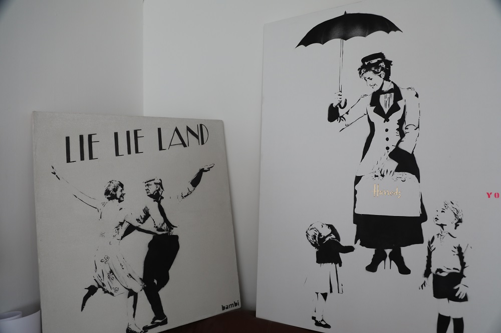 Artwork by the anonymous female street artist u00e2u20acu02dcBambiu00e2u20acu2122 is depicted in her studio in London October 30. 2019. u00e2u20acu201d Thomson Reuters Foundation pic