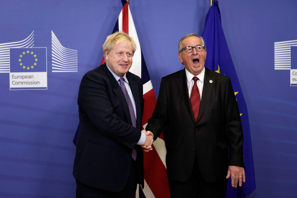 British Prime Minister Boris Johnson shakes hands with President of the European Commission Jean-Claude Juncker as they prepare to address a press conference at a European Union Summit at European Union Headquarters in Brussels October 17, 2019. u00e2u20acu201d AFP p