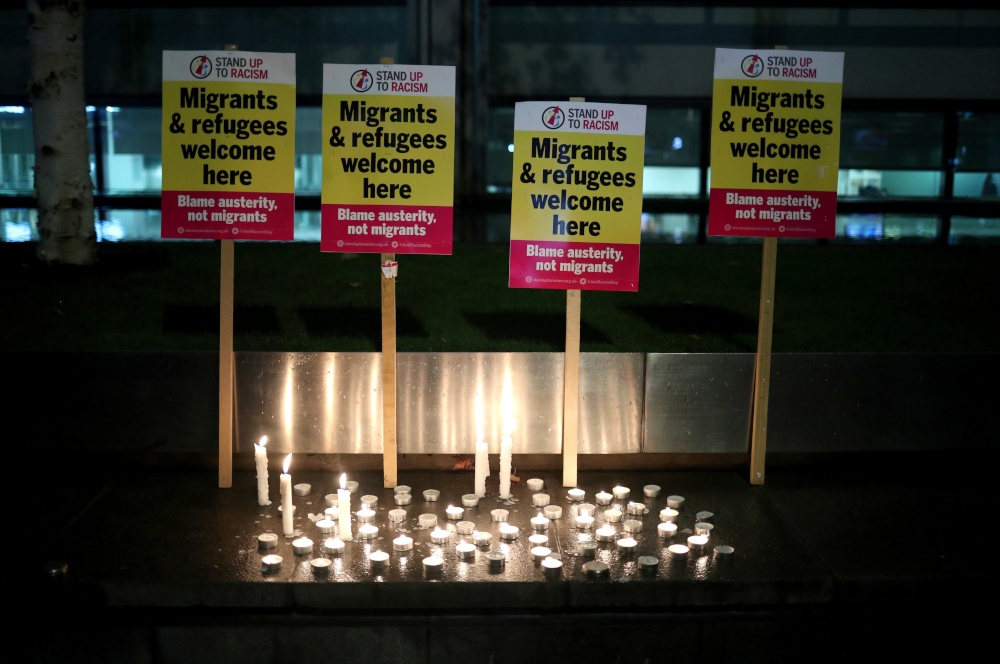 Placards and candles placed by anti-racism campaigners are seen during a vigil, following the discovery of 39 bodies in a truck container on Wednesday, outside the Home Office in London, Britain October 24, 2019. u00e2u20acu201d Reuters pic 