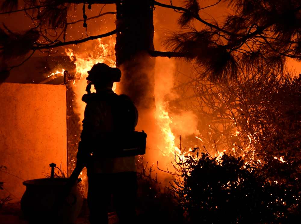 Firefighters battle a wind-driven wildfire called the Saddle Ridge fire in the early morning hours Friday in Porter Ranch, California October 11, 2019. u00e2u20acu2022 Reuters pic