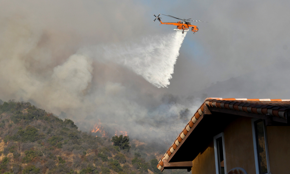 A firefighting helicopter makes a water drop on the Getty Fire as it burns in the hills of West Los Angeles, California, US October 28, 2019. u00e2u20acu201d Reuters pic 