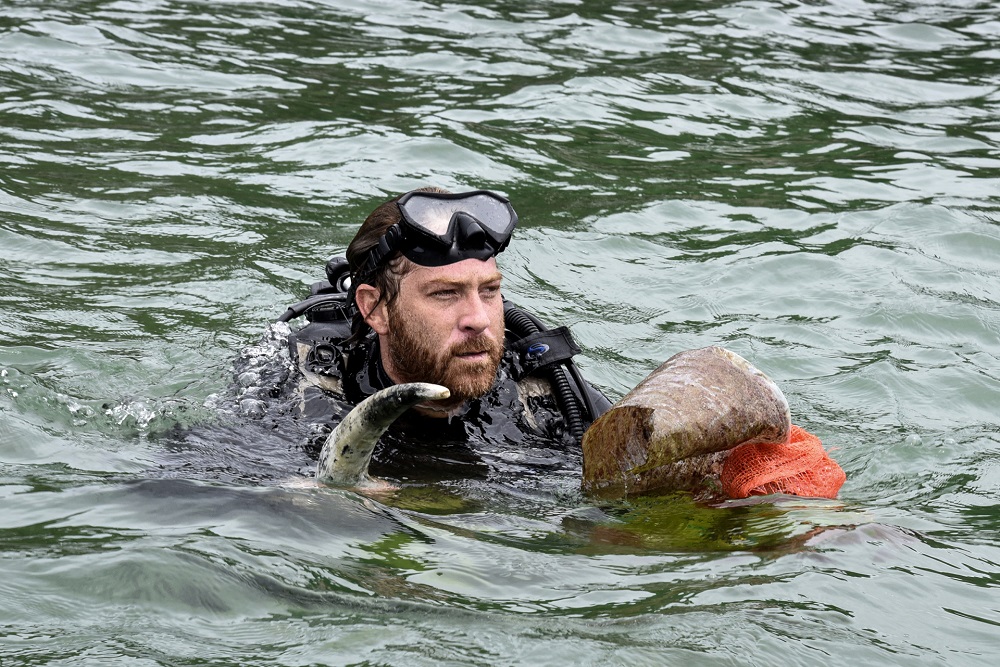 A scuba diver collects plastic waste and other items from a bay during a u00e2u20acu02dcclean-up dayu00e2u20acu2122 campaign of the ocean off the coast of the capital Dakar September 15, 2019. u00e2u20acu201d AFP pic    