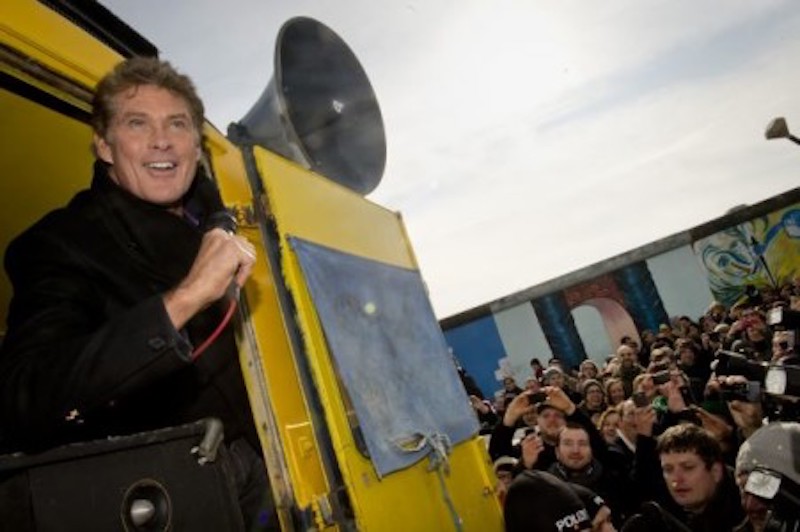 US actor and singer David Hasselhoff speaks to the crowd from a truck as he tours the East Side Gallery part of the remains of the former Wall in Berlin in 2013. u00e2u20acu201d AFP-Relaxnews pic