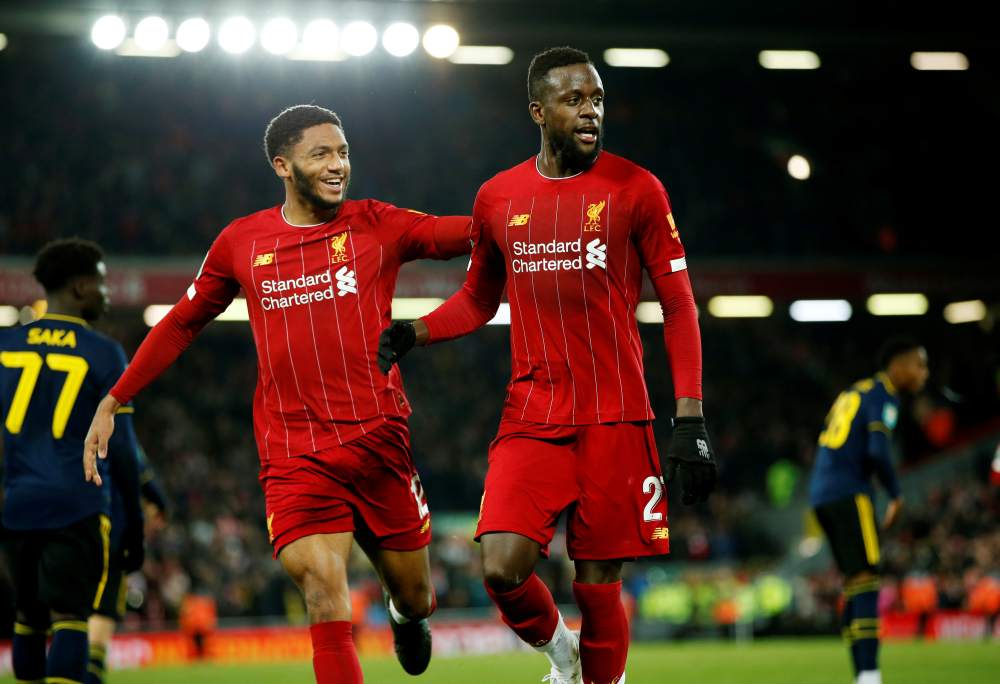 Liverpool's Divock Origi celebrates with teammate Joe Gomez after scoring the fifth goal against Arsenal October 31, 2019. u00e2u20acu2022 Reuters pic