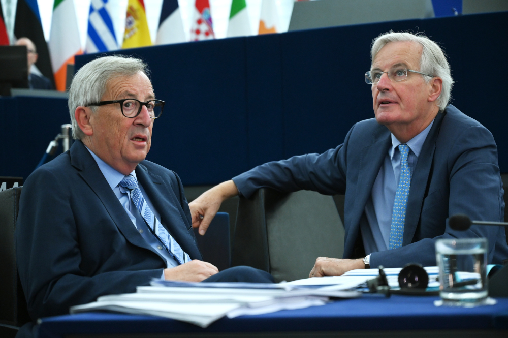 EU chief Brexit negotiator Michel Barnier (right) speaks with European Commission President Jean-Claude Juncker ahead of a debate on the results of October EU summit at the European Parliament October 22, 2019 in Strasbourg, eastern France. u00e2u20acu201d AFP pic