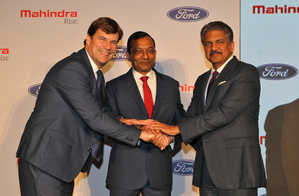 Jim Farley, President of Ford New Businesses, Technology and Strategy, Pawan Goenka, Managing Director of Mahindra and Mahindra Limited, and Anand Mahindra, Chairman of Mahindra Group, at a news conference in Mumbai, India, October 1, 2019. u00e2u20acu201d Reuters pi