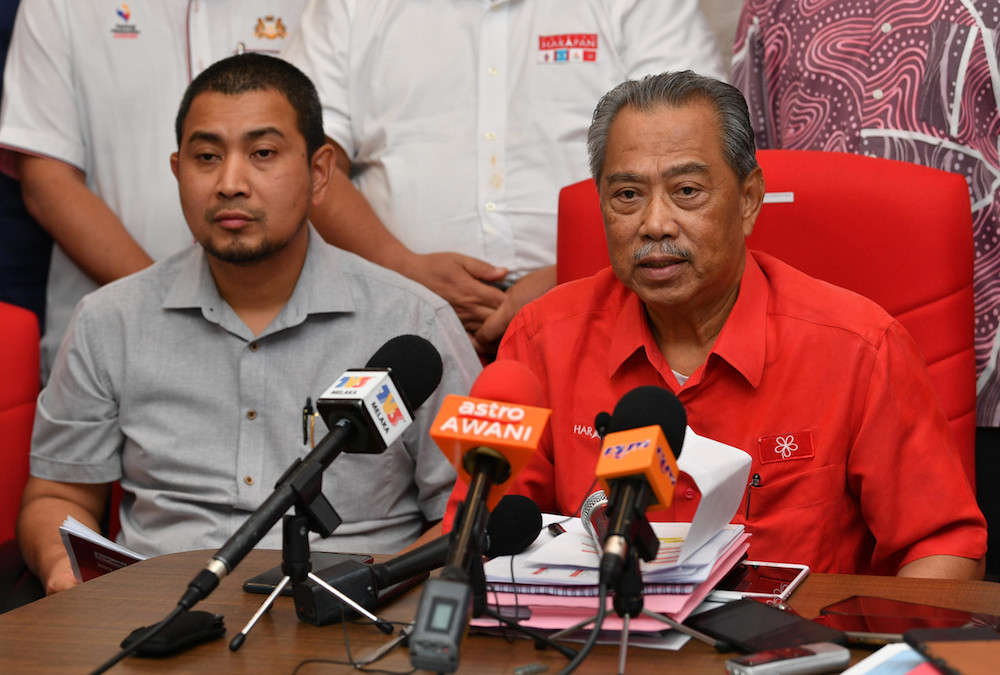 Johor Mentri Besar Datuk Dr Sahruddin Jamal and Johor Pakatan Harapan chairman Tan Sri Muhyiddin Yassin address a press conference in Muar October 4, 2019. u00e2u20acu201d Bernama pic