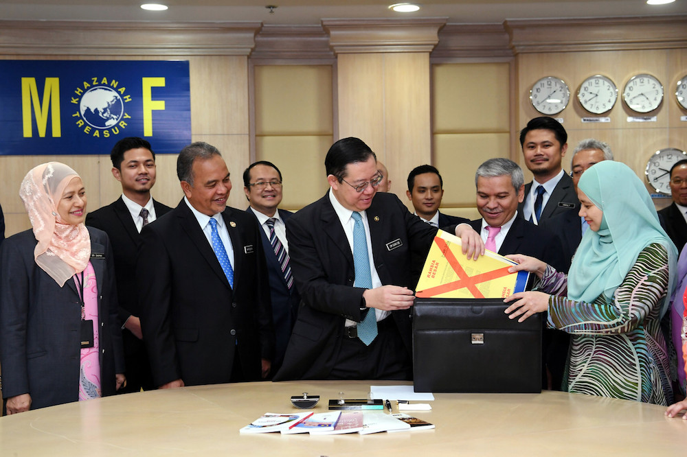 Finance Minister Lim Guan Eng places his Budget 2020 speech into a briefcase at the Finance Ministry in Putrajaya October 10, 2019. u00e2u20acu201d Bernama pic