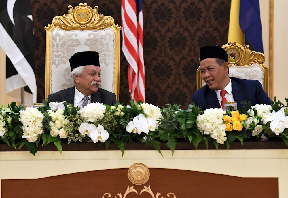 Yang Dipertuan Besar of Negri Sembilan Tuanku Muhriz Tuanku Munawir chats with Negri Sembilan Mentri Besar Datuk Seri Aminuddin Harun during the 255th meeting of the Conference of Rulersu00e2u20acu2122 at Istana Negara in Kuala Lumpur October 30, 2019. u00e2u20acu201d Bernama pi