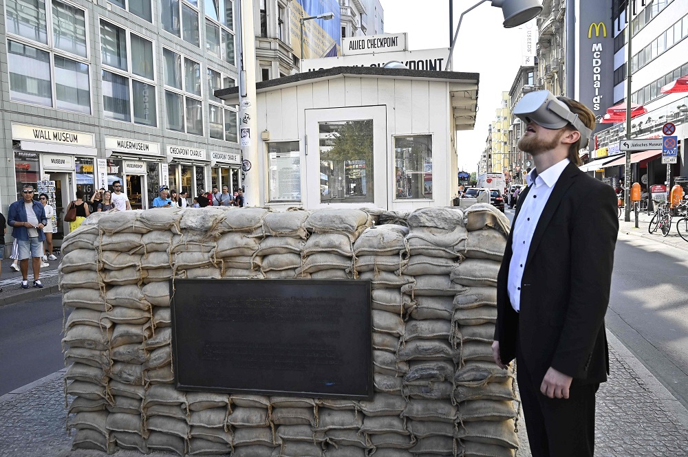 In this file photo taken on August 22, 2019 Jonas Rothe, founder and CEO of Timeride, a company offering Virtual Reality tours through a still-divided Berlin, poses next to Checkpoint Charlie on August 22, 2019 in Berlin. u00e2u20acu201d AFP pic     