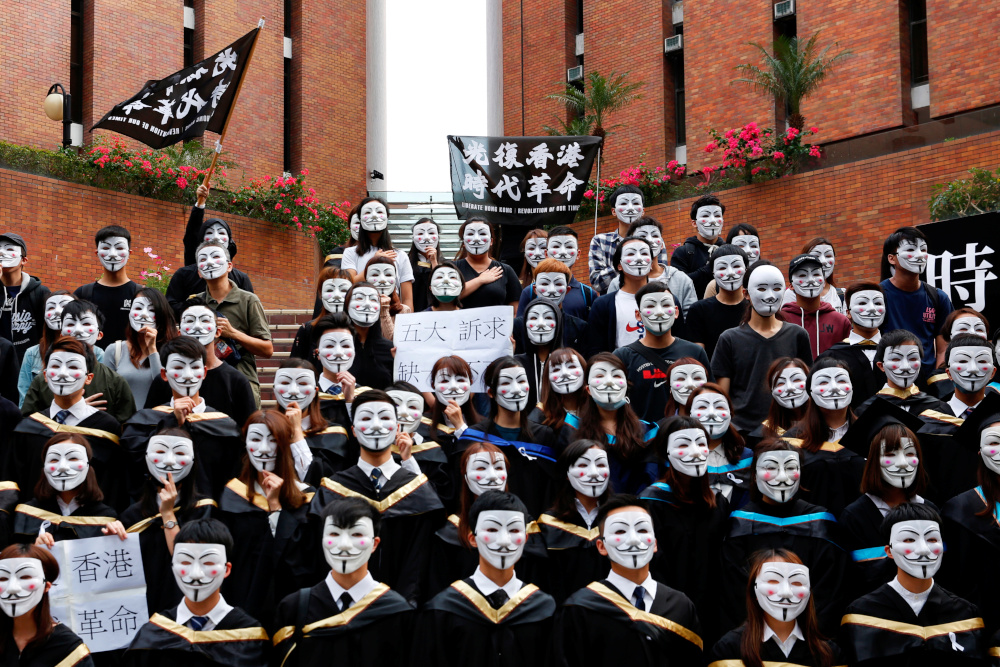 University students wearing Guy Fawkes masks pose for a photoshoot of a graduation ceremony to support anti-government protests at the Hong Kong Polytechnic University, in Hong Kong, China October 30, 2019. u00e2u20acu201d Reuters pic 