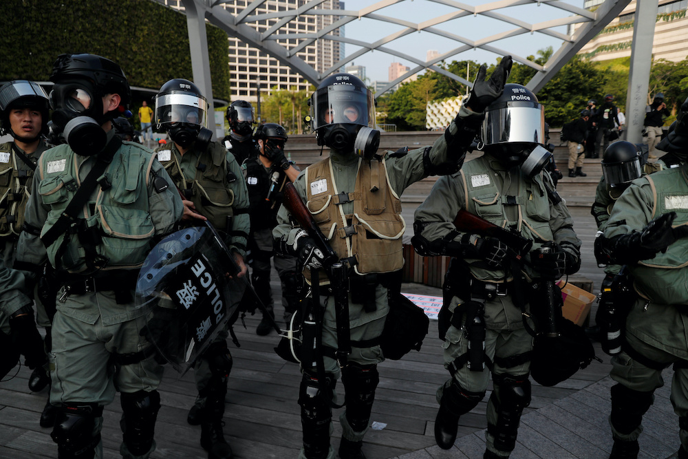 Police officers react during an anti-government protest in Hong Kongu00e2u20acu2122s tourism district of Tsim Sha Tsui, China October 27, 2019. u00e2u20acu201d Reuters picnn