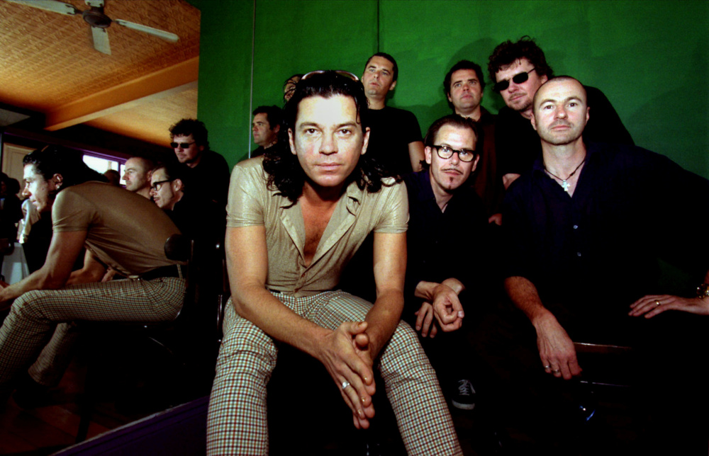 Australian band INXS, (from left) lead singer Michael Hutchence, Jon Farriss, Kirk Pengilly, Andrew Farriss, Tim Farriss and Garry Beers pose for a photograph after a news conference in Sydney September 25, 1996. u00e2u20acu201d Reuters pic 
