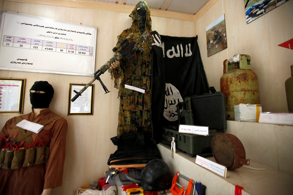 An Islamic State flag and items which were used by Islamic State militants are seen at a museum opened by the Engineering Unit of Peshmerga forces in Erbil, Iraq May 12, 2019. u00e2u20acu201d Reuters pic            