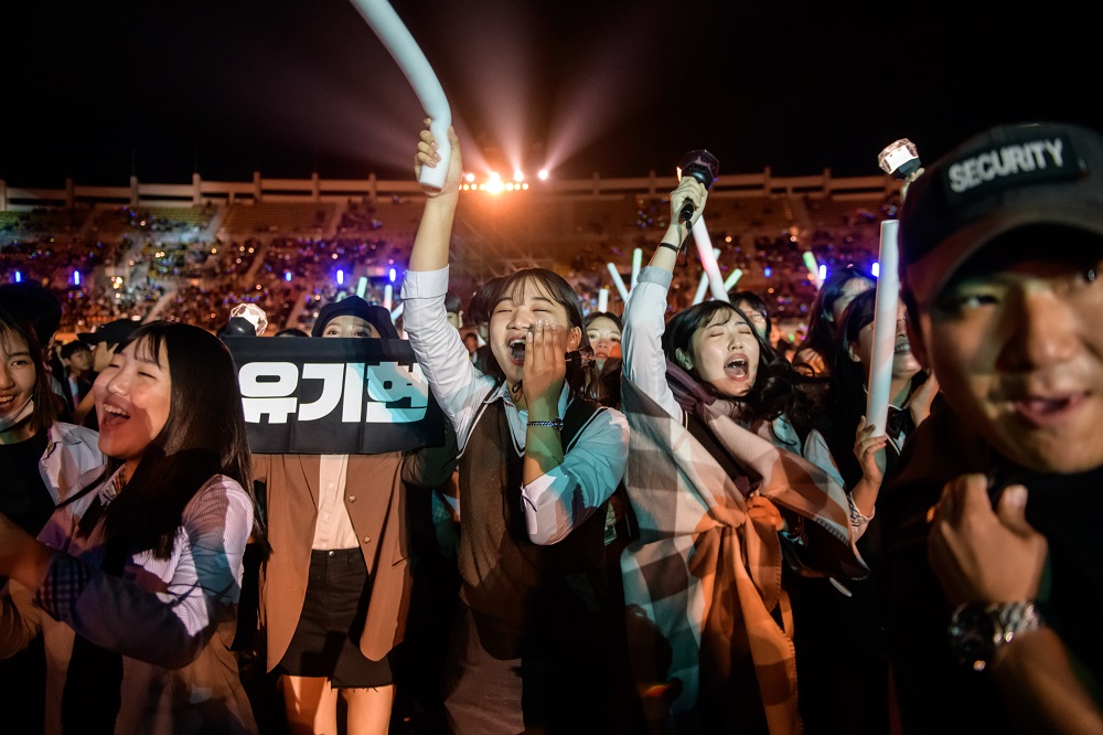 In a photo taken on October 11, 2019, audience members cheer for a professional K-pop band performing between rounds of amateurs, at the K-pop World Festival in Changwon. u00e2u20acu201d AFP pic