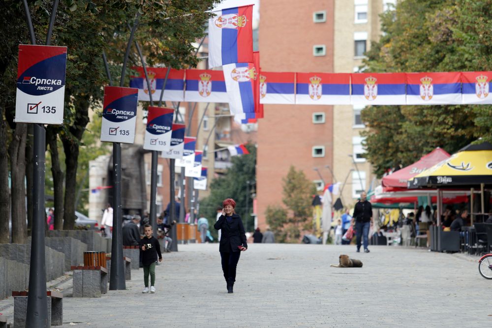 People walk through street decorated with Serbian flags in Mitrovica, Kosovo, October 5, 2019. u00e2u20acu201d Reuters pic
