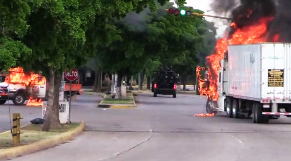 In this AFPTV screengrab, trucks burn in a street of Culiacan, capital of jailed kingpin Joaquin u00e2u20acu02dcEl Chapou00e2u20acu2122 Guzmanu00e2u20acu2122s home state of Sinaloa October 17, 2019. u00e2u20acu201d AFP pic   