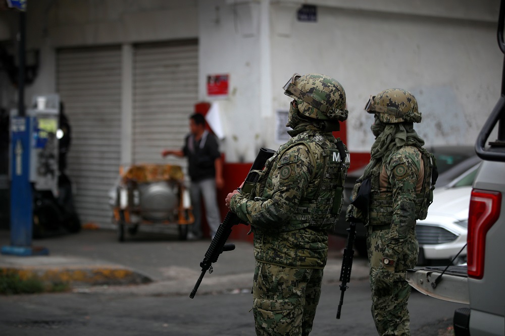 Mexican Marines keep watch during a raid on a warren of clandestine tunnels and alleged drug laboratories at Tepito neighbourhood in downtown Mexico City, Mexico October 22, 2019. u00e2u20acu201d Reuters pic          