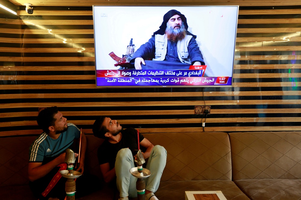 Iraqi youth watch the news of Islamic State leader Abu Bakr al-Baghdadi death, in Najaf, Iraq October 27, 2019. u00e2u20acu201d Reuters pic          