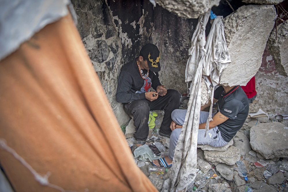 Moroccan addicts smoke heroin in a squat behind a police station in the Moroccan city of Mu00e2u20acu2122diq near Tetouan September 14, 2019. u00e2u20acu201d AFP pic        