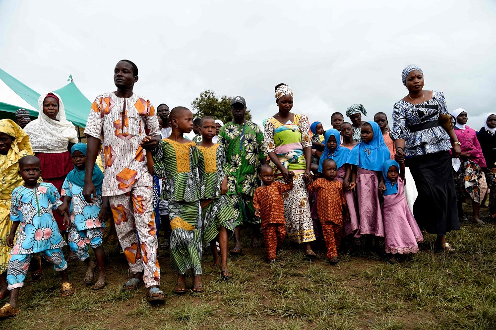 Parents lead children during a parade of twins at the Igbo-Ora World Twins festival to celebrate the uniqueness in multiple births at Igbo-Ora Town in Oyo State, southwest Nigeria October 12, 2019. u00e2u20acu201d AFP pic  