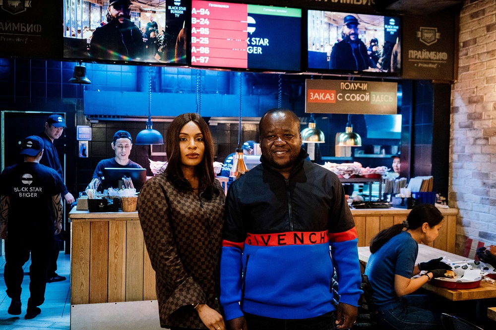 Cameroonian entrepreneur couple u00e2u20acu201d Walter, 37, and Cindy, 32, Tchassem u00e2u20acu201d pose during an interview with AFP at an outlet of the coupleu00e2u20acu2122s Black Star burger chain on Moscowu00e2u20acu2122s Novy Arbat October 21, 2019. u00e2u20acu201d AFP pic