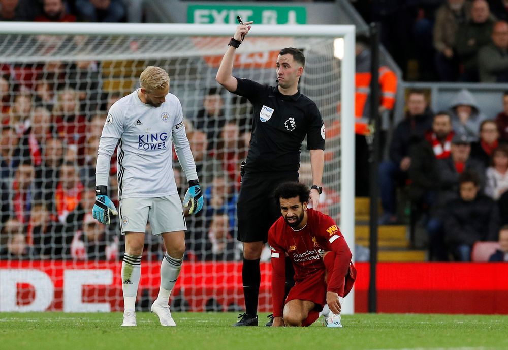Referee Chris Kavanagh gestures after Liverpoolu00e2u20acu2122s Mohamed Salah goes down due to an injury during their Premier League match against Leicester City in Anfield, Liverpool, October 5, 2019. u00e2u20acu201d Reuters pic