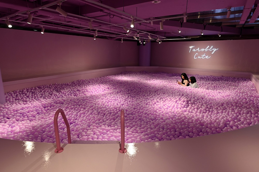 Visitors sit inside the u00e2u20acu02dcpearlsu00e2u20acu2122 pool installation at The Bubble Tea Factory experience created by the El Masnou collective during a preview in Singapore October 15, 2019. u00e2u20acu201d AFP pic  