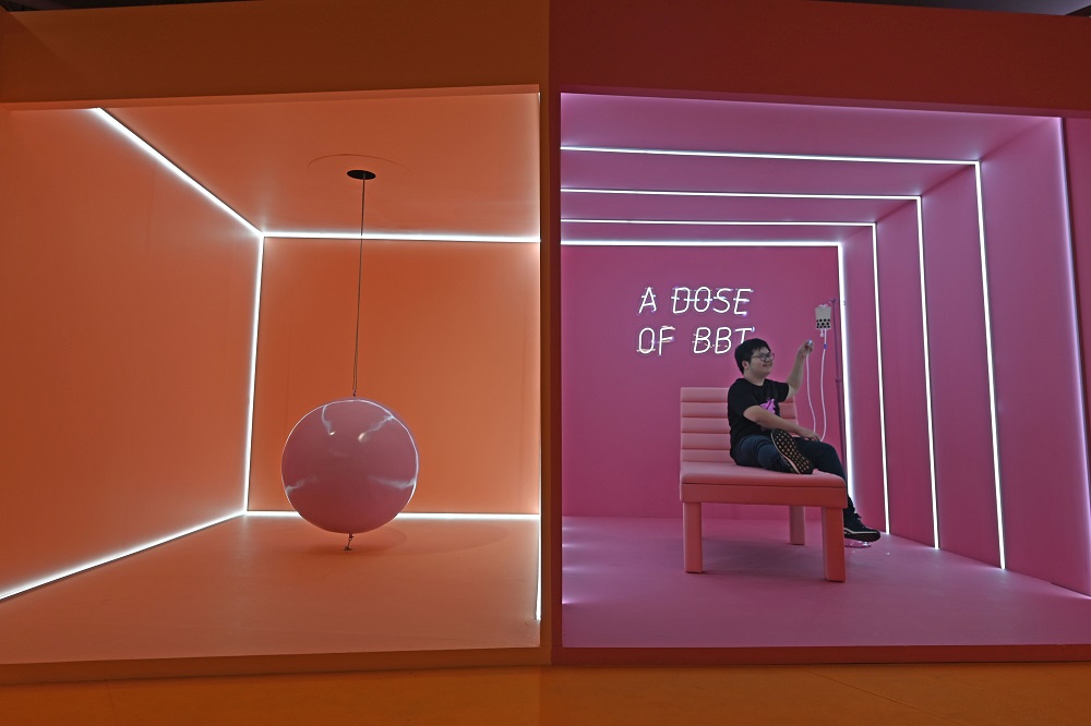 A visitor sits in an installation at The Bubble Tea Factory experience created by the El Masnou collective during a preview in Singapore October 15, 2019. — AFP pic