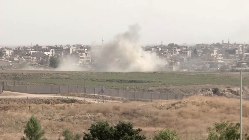 Smoke billows out after Turkish shelling on the Syrian border towns of Qamishli and Ras Al Ain, as seen from Nusaybin, Turkey, October 11, 2019 in this still image taken from a video. u00e2u20acu201d ReutersTV pic