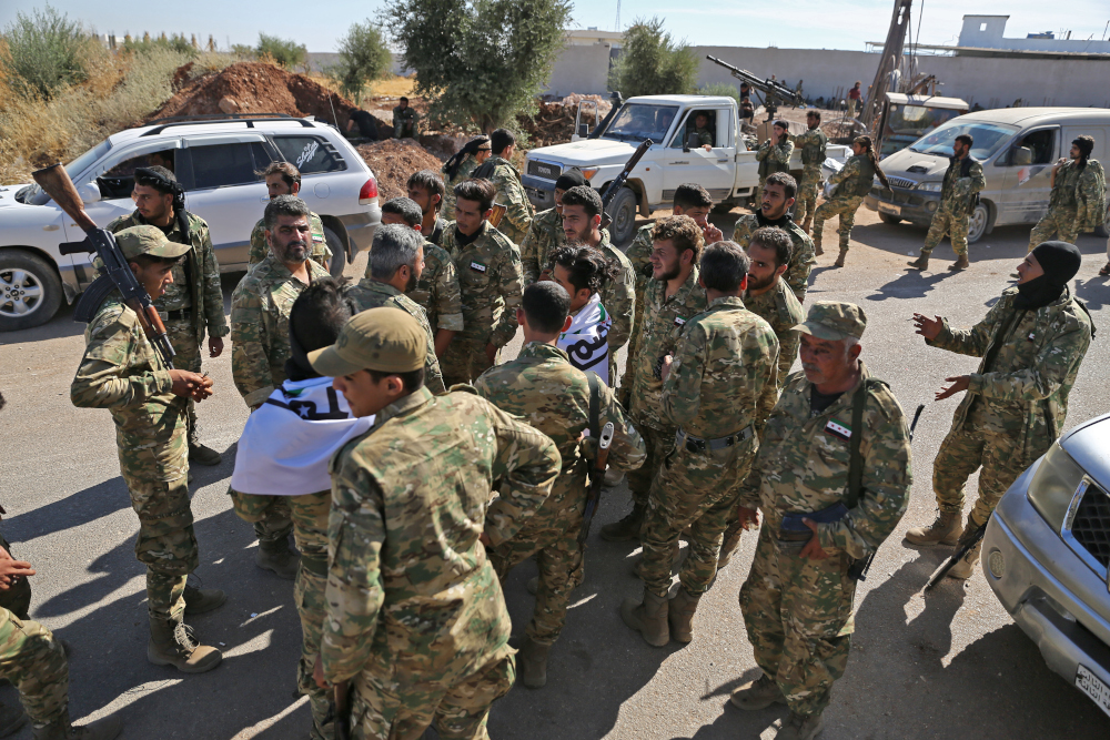 Pro-Turkish Syrian fighters near the town of Azaz in Syriau00e2u20acu2122s northern Aleppo province as they prepare to take part in an offensive against Kurdish-controlled areas in northeastern Syria launched by the Turkish military yesterday, October 10, 2019. u00e2u20acu201d A