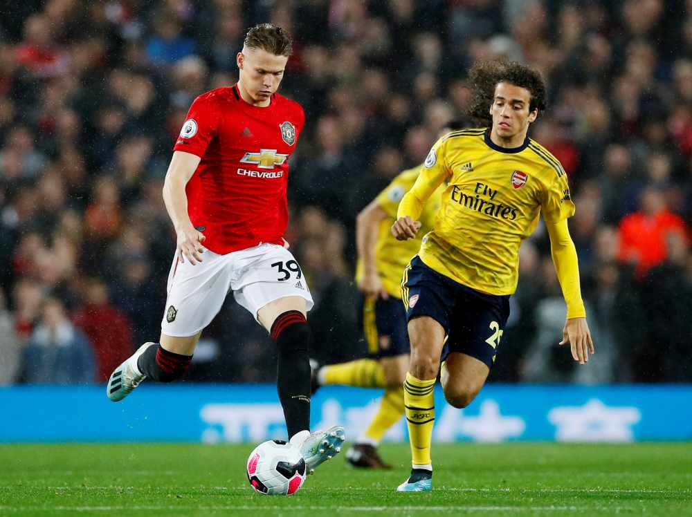 Manchester United's Scott McTominay in action with Arsenal's Matteo Guendouzi at Old Trafford, October 1, 2019. u00e2u20acu2022 Reuters pic