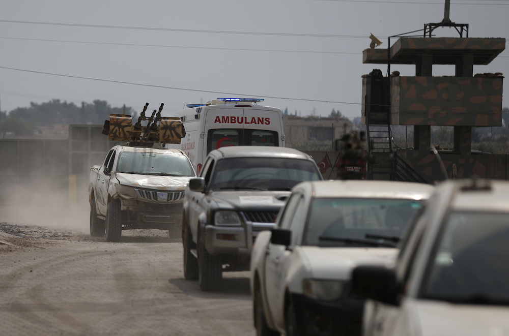 Turkey-backed Syrian rebel fighters return from the Syrian border town of Tal Abyad, as they are pictured on the Turkish-Syrian border in Akcakale, Turkey, October 19, 2019. u00e2u20acu201d Reuters picnn