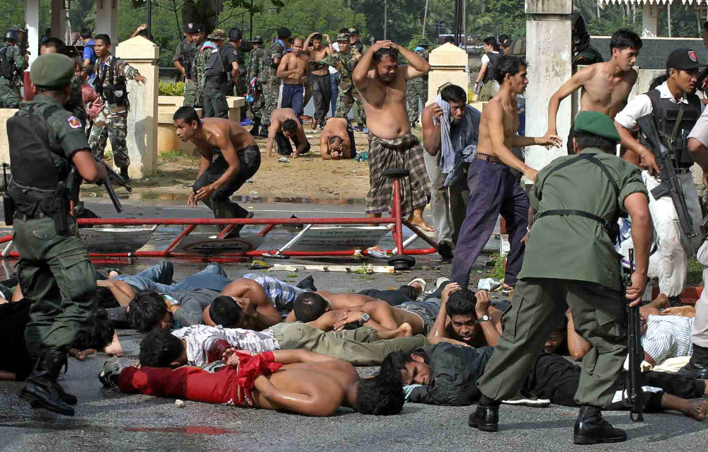 In this file photo taken October 25, 2004, police and soldiers arrest demonstrators at Tak Bai police station in Thailandu00e2u20acu2122s southern province of Narathiwat. u00e2u20acu201d AFP pic 
