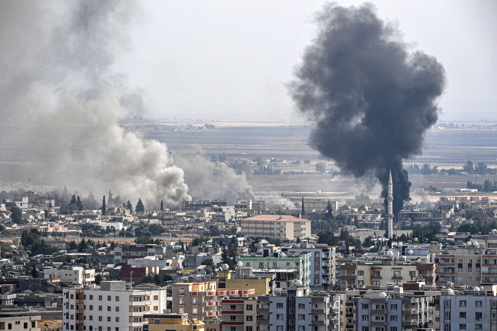 This picture taken October 16, 2019 from the Turkish side of the border at Ceylanpinar district in Sanliurfa shows smoke rising from the Syrian town of Ras al-Ain on the eighth day of Turkeyu00e2u20acu2122s military operation against Kurdish forces. u00e2u20acu201d AFP pic 