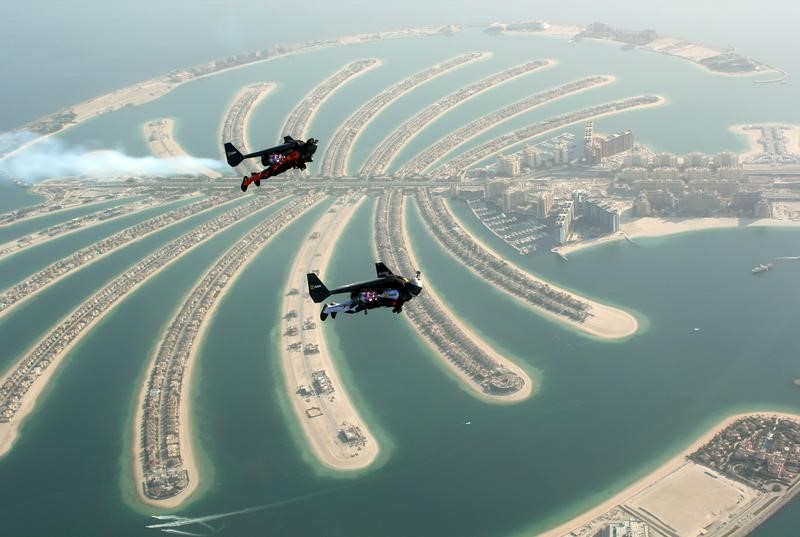 An aerial view taken from a sea plane shows Swiss pilot and original Jetman Yves Rossy (front) and Vince Reffett flying over Dubaiu00e2u20acu2122s Palm Island, Dubai, United Arab Emirates May 12, 2015. u00e2u20acu201d Reuters pic