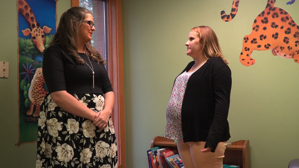 A screengrab taken from a video on October 17, 2019 in Warren, Ohio shows Emily McIntyre (right), a recovery addict in the QIC programme talking to Lauren Wimer, a child services caseworker. u00e2u20acu201d AFP pic 