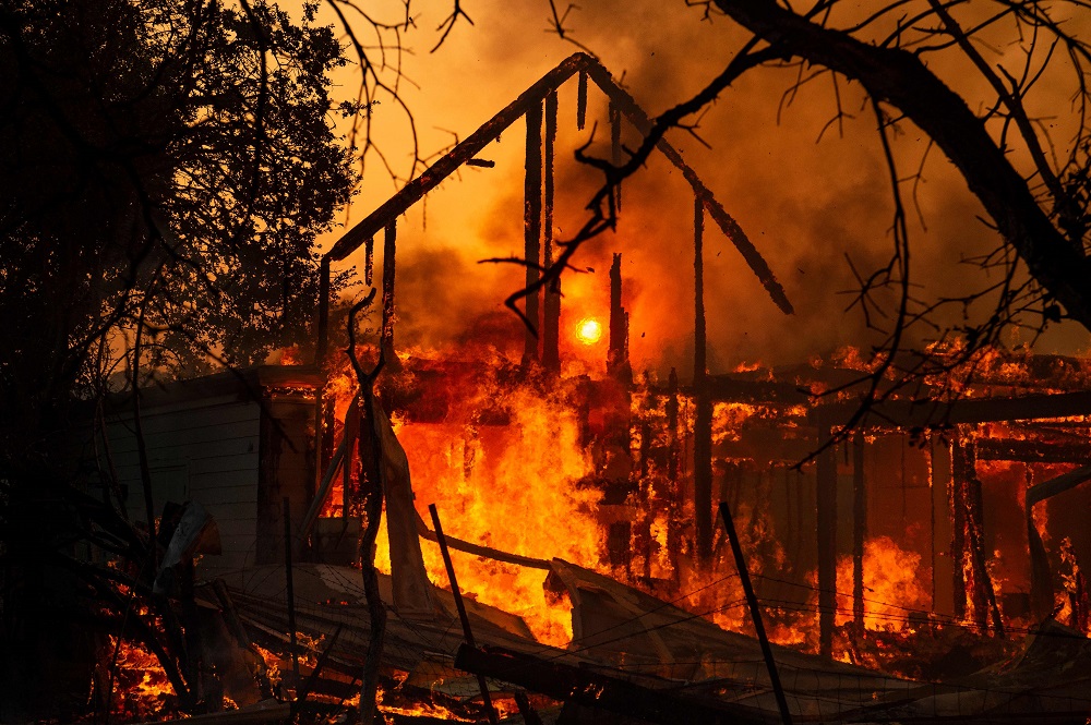 The frame of a house still stands as it burns in front of the rising sun during the Kincade fire in Healdsburg, California October 27, 2019. u00e2u20acu201d AFP pic  