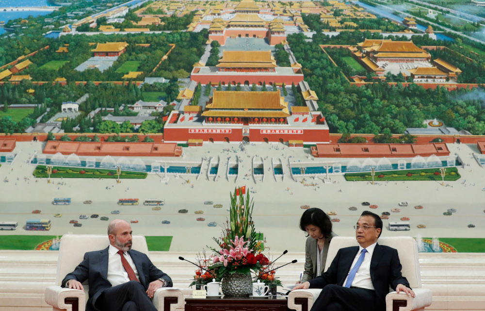 Chairman of the US-China Business Council, Evan Greenberg (left), attends a meeting with Chinese Premier Li Keqiang at the Great Hall of the People in Beijing October 17, 2019. u00e2u20acu201d AFP pic