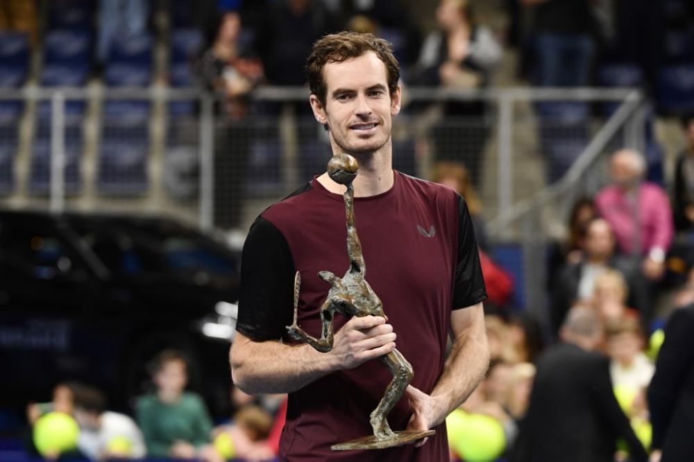 Britain's Andy Murray celebrates with the trophy after winning against Switzerland's Stanislas Wawrinka in their men's single tennis final match of the European Open ATP in Antwerp October 20, 2019. u00e2u20acu2022 AFP pic