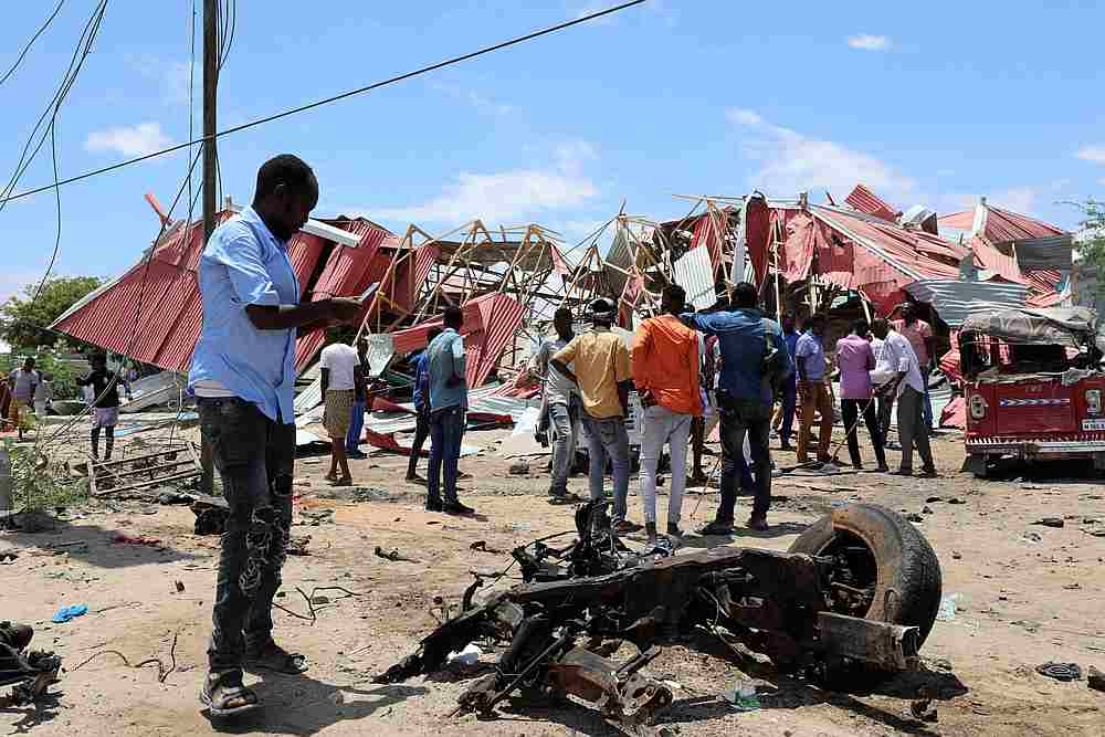 Somalis inspect the damage caused at the scene of an attack on an Italian military convoy in Mogadishu, Somalia September 30, 2019. u00e2u20acu201d Reuters pic