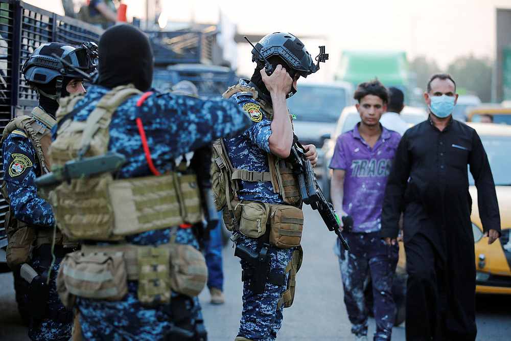 Members of Iraqi federal police are seen with military vehicles in a street in Baghdad October 7, 2019. u00e2u20acu201d Reuters pic