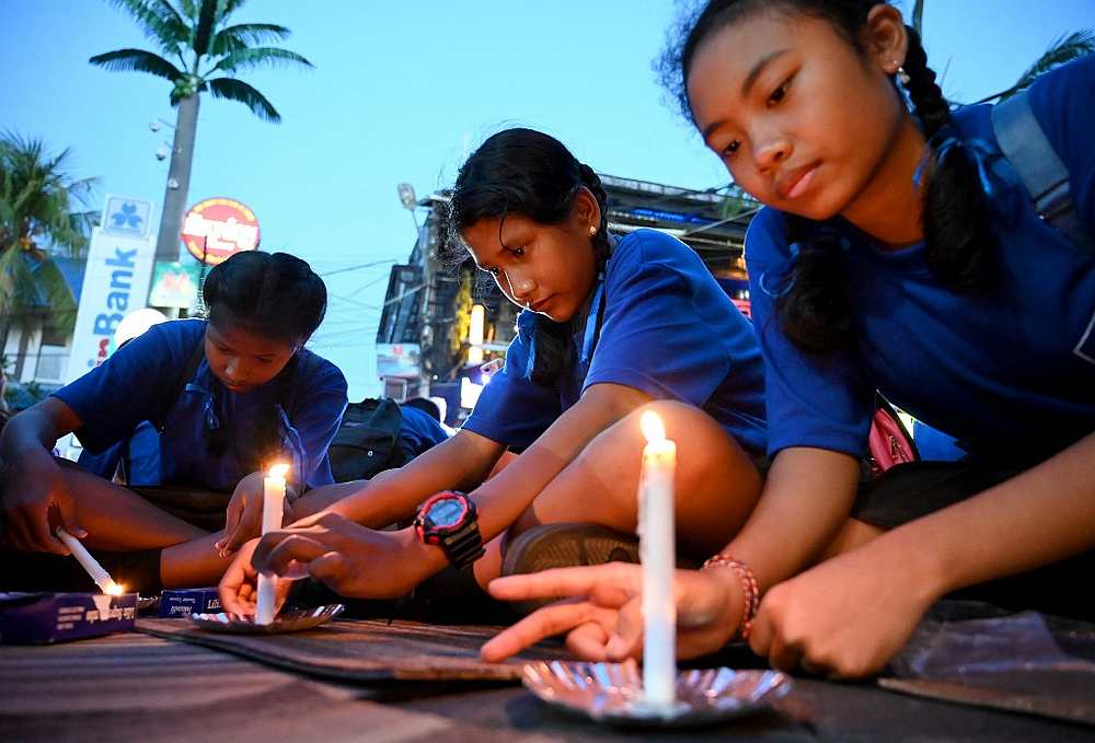 Schoolchildren light candles during a memorial service for the victims of the 2002 Bali bombings to mark the 17th anniversary of the attacks in Kuta near Denpasar on Bali island October 12, 2019. u00e2u20acu201d AFP pic