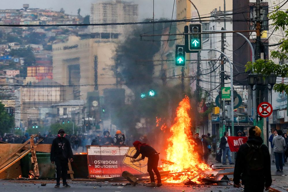 Demonstrators burn objects as they barricade a road during a protest against the government in Valparaiso, Chile October 19, 2019. u00e2u20acu201d Reuters pic