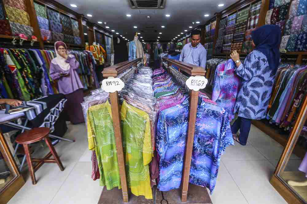You can find hand-printed batik as well as machine-printed batik shirts in most shops nowadays.