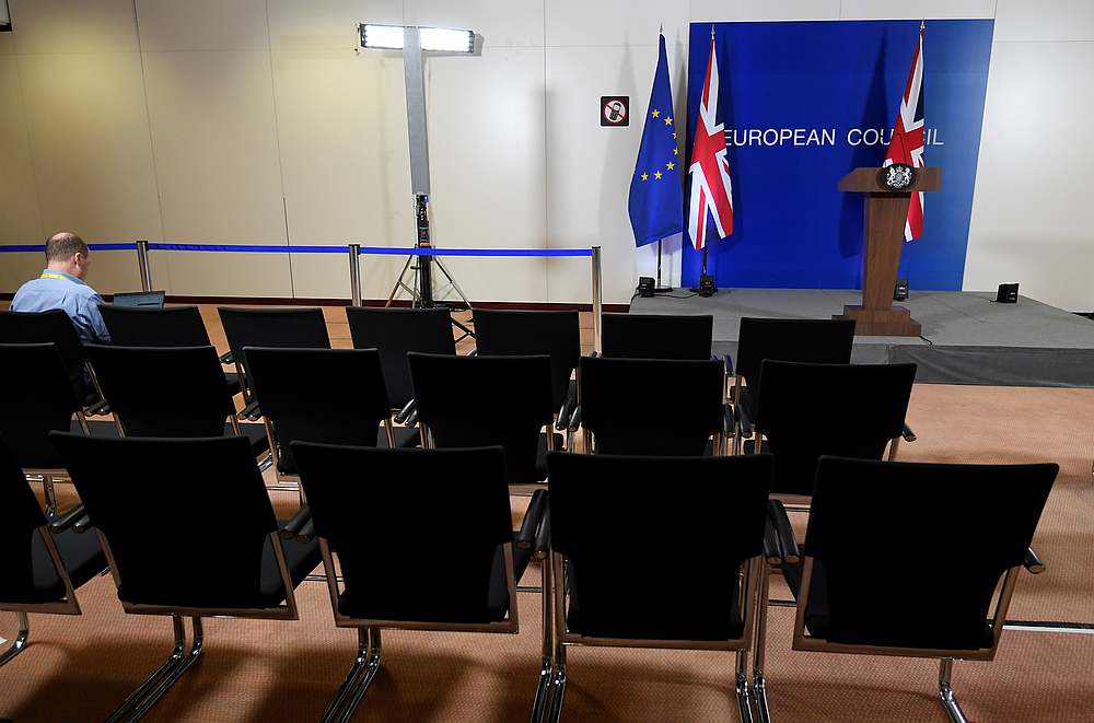 A journalist sits in an empty press room after Britain's Prime Minister Boris Johnson held a news conference at the European Union leaders summit dominated by Brexit, in Brussels, Belgium October 17, 2019. u00e2u20acu201d Reuters pic