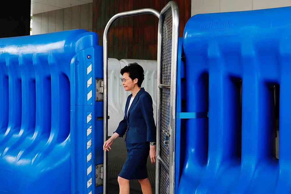 Hong Kong Chief Executive Carrie Lam walks past a barrier to meet petitioners before a weekly Executive Council meeting in Hong Kong October 8, 2019. u00e2u20acu201d Reuters pic