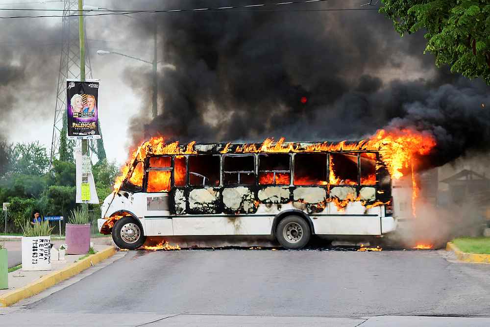 A burning bus is pictured during clashes with federal forces following the detention of Ovidio Guzman, son of drug kingpin Joaquin 'El Chapo' Guzman, in Culiacan, Sinaloa state, Mexico October 17, 2019. u00e2u20acu201d Reuters pic